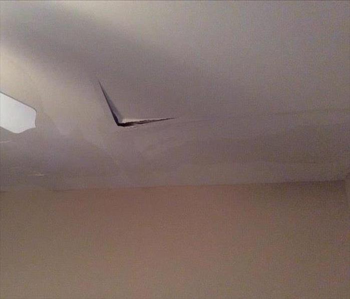water-stained ceiling, broken ceiling material